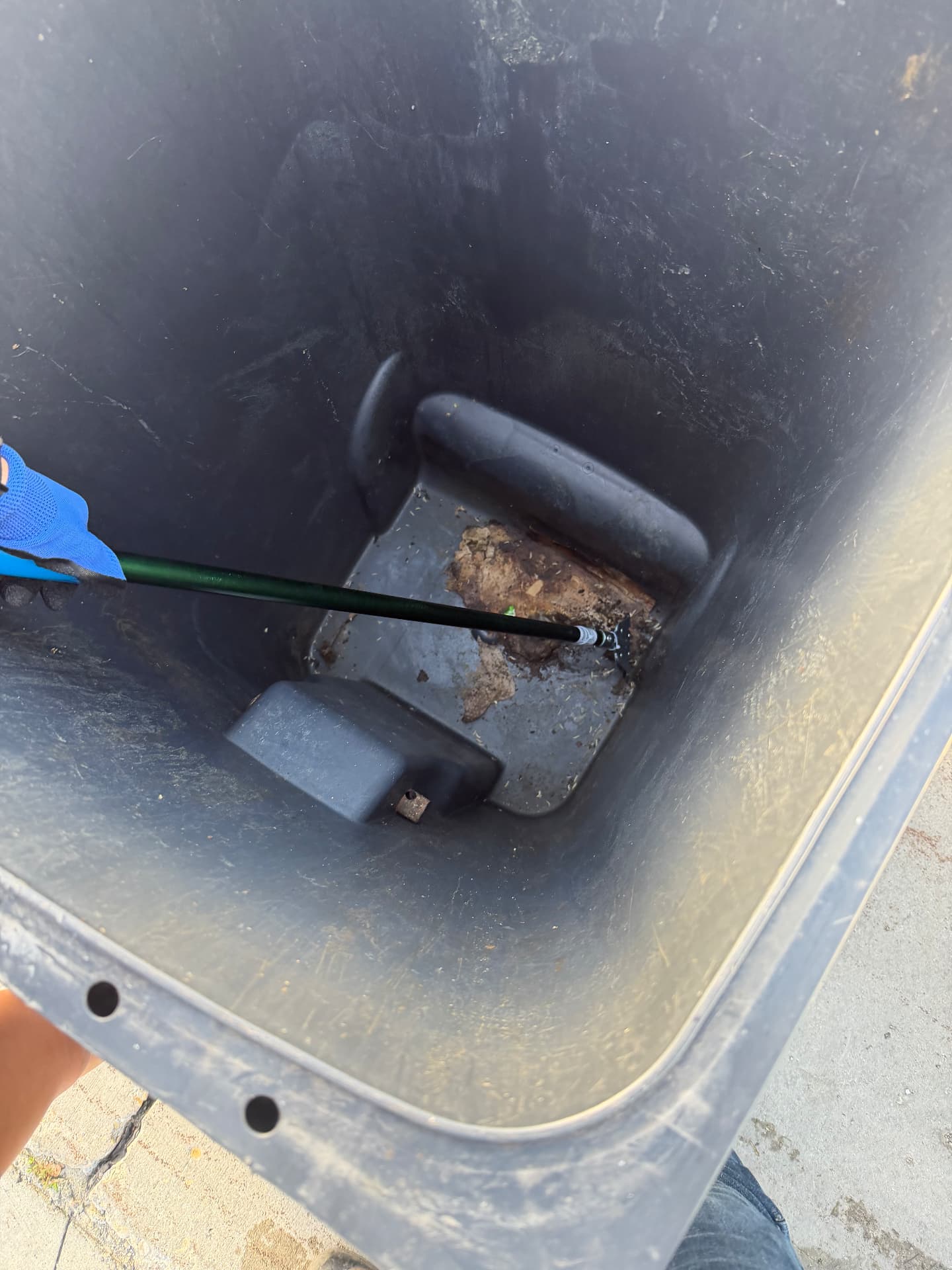 Bin interior with grime before EcoRinse cleaning